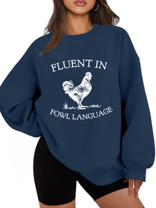 Detail of navy blue sweatshirt featuring white rooster print and Fluent in Fowl Language text