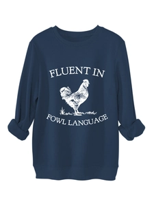 Detail of navy sweatshirt featuring artistic rooster print and witty fowl language text