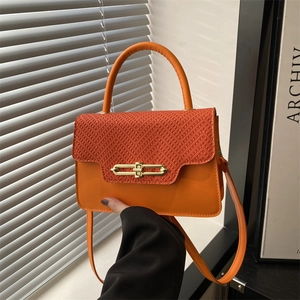 Bright orange crossbody bag with woven texture, metal lock, and top handle for women