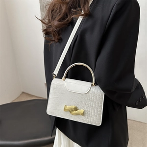 White faux crocodile skin crossbody bag with gold wave lock and metal handle