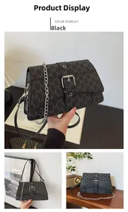 Detail of black crossbody bag featuring grey M-pattern monogram and silver chain strap