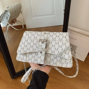 White monogram shoulder bag with metallic buckle and leather chain strap in modern style