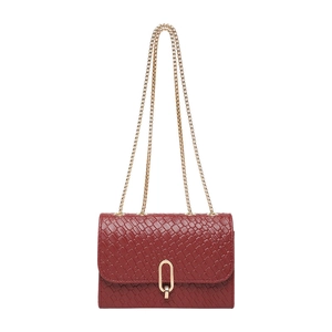 Red crocodile embossed leather chain bag with golden oval clasp on white background