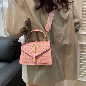 Pink woven texture crossbody bag for women with gold clasp and patterned shoulder strap