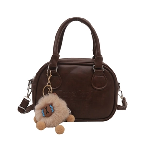 Brown leather handbag with lucky CHIC mu embossing and a cute sheep plush charm