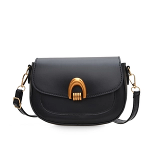 Minimalist black matte leather saddle bag with gold horseshoe buckle and thin strap