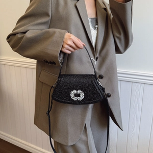 Mini black glitter shoulder bag with iconic crystal buckle and adjustable strap