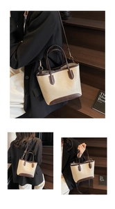 Detail of vintage tote bag showing versatile hand-carry and shoulder strap styling