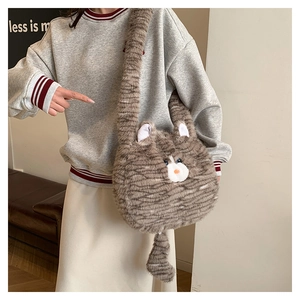 Detail of cute cat-shaped plush crossbody bag with realistic fur texture and tail