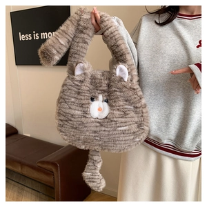 Detail of grey tabby cat plush tote bag featuring soft faux fur and long tail handle