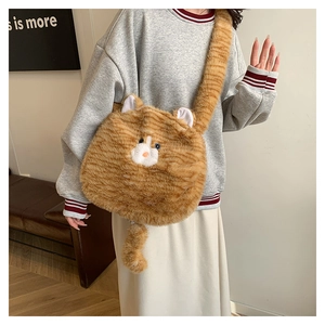 Close-up of cute plush orange tabby cat crossbody bag with fuzzy tail shoulder strap