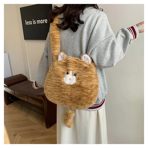 Rear view of model wearing a plush orange tabby cat crossbody bag with creative tail strap