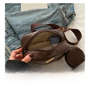 Detailed interior capacity view of dark brown quilted crossbody bag with items