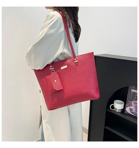 Red lychee textured large tote bag with matching coin purse and metallic logo plate