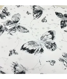 Macro view of high-density jacquard fabric with elegant butterfly and constellation patterns