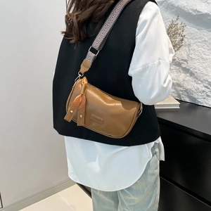 Brown PU leather retro pillow bag with ethnic style wide strap and ribbon decoration