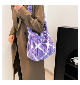Detail of large purple and white checkered plush tote bag with fuzzy texture on model