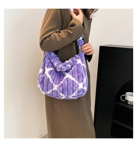 Detail of purple and white striped plush tote bag with a soft faux fur texture