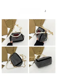 Detailed views of a black velvet handbag with rhinestone heart pattern and pearl handle
