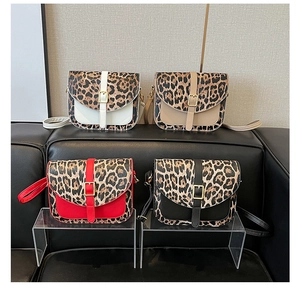 Detailed grid view of four leopard print shoulder bags in white, beige, red, and black