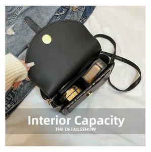 Internal capacity of the black saddle bag showing space for cosmetics and daily items