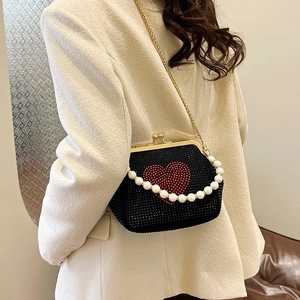 Elegant black evening bag with red heart crystal design and pearl handle strap