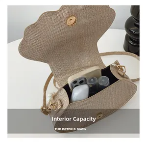 Interior view of shell-shaped felt bag showing space for phone and makeup