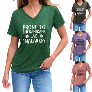 Detail view of V-neck T-shirts in multiple colors with Shamrock Shenanigans print