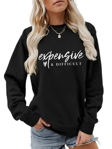 Detail of crew neck ribbing and text print on black long sleeve sweatshirt