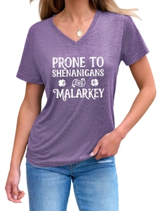 Detail of V-neck heather purple T-shirt with white shenanigans text and shamrock design