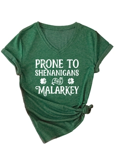 Detail of green heather V-neck T-shirt with white text and St. Patrick's clover print