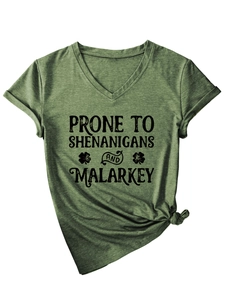 Detail of army green V-neck T-shirt with 'Prone to Shenanigans' print and knotted hemline