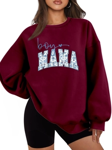 Detail of floral MAMA letters and blue boy script on burgundy crewneck sweatshirt
