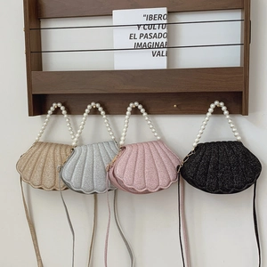 Elegant pearl handle shell bags in champagne, silver, pink, and black colors