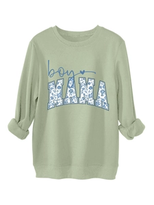 Detail of light green sweatshirt collar with floral boy MAMA textured graphic print