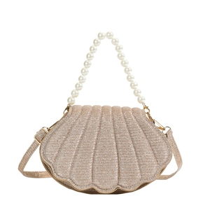 Elegant champagne gold shell-shaped evening bag with pearl handle and sequin finish