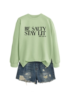 Mint green pullover sweatshirt with BE SALTY STAY LIT print and denim shorts outfit