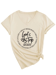 Detail of Girl's Trip 2025 graphic print on cream V-neck tee with folded cuffs