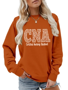 Detail of orange sweatshirt with leopard print CNA Certified Nursing Assistant lettering