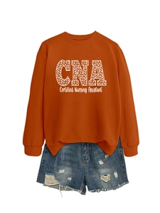Detail of CNA leopard print sweatshirt paired with blue ripped denim shorts