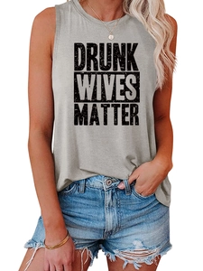Detail of grey sleeveless top with Drunk Wives Matter print and denim shorts