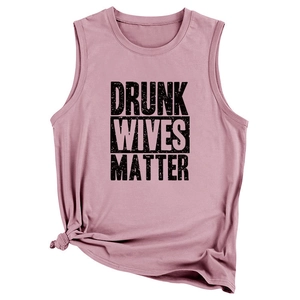 Detail of a dusty rose sleeveless tank top with DRUNK WIVES MATTER slogan and side knot