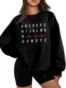Close-up of black oversized sweatshirt with white A-Z alphabet and red heart rate print