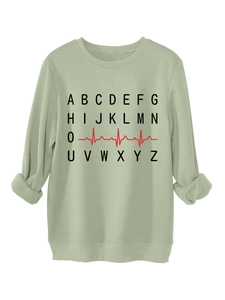 Close-up of light green fleece sweatshirt featuring creative A-Z heart rate monitor print