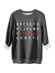 Detail of dark grey fleece sweatshirt showing white plush lining and alphabet heartbeat print