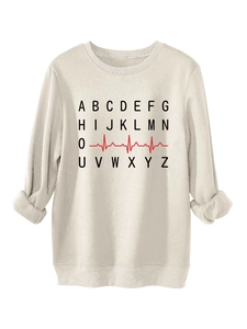 Detail of cream-colored crewneck sweatshirt featuring a black alphabet and red EKG design