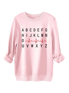 Detail of pink sweatshirt fabric showing black alphabet print and red EKG heart line
