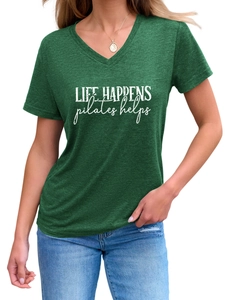 Close-up of Life Happens Pilates Helps slogan on women's V-neck T-shirt in forest green