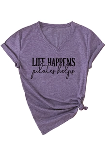 Detail of V-neck purple Pilates T-shirt showing knotted hem and rolled sleeves design