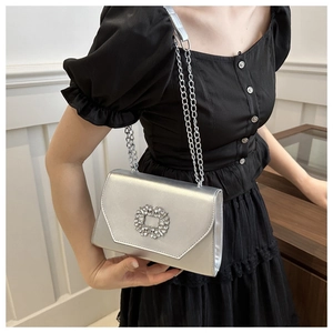 Silver square evening clutch with rhinestone buckle and delicate metal chain strap